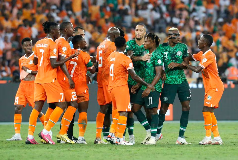 Soccer Football - Africa Cup of Nations - Final - Nigeria v Ivory Coast - Stade Olympique Alassane Ouattara, Abidjan, Ivory Coast - February 11, 2024 Nigeria's Samuel Chukwueze remonstrates with Ivory Coast's Seko Fofana and teammates. Photo: Reuters
