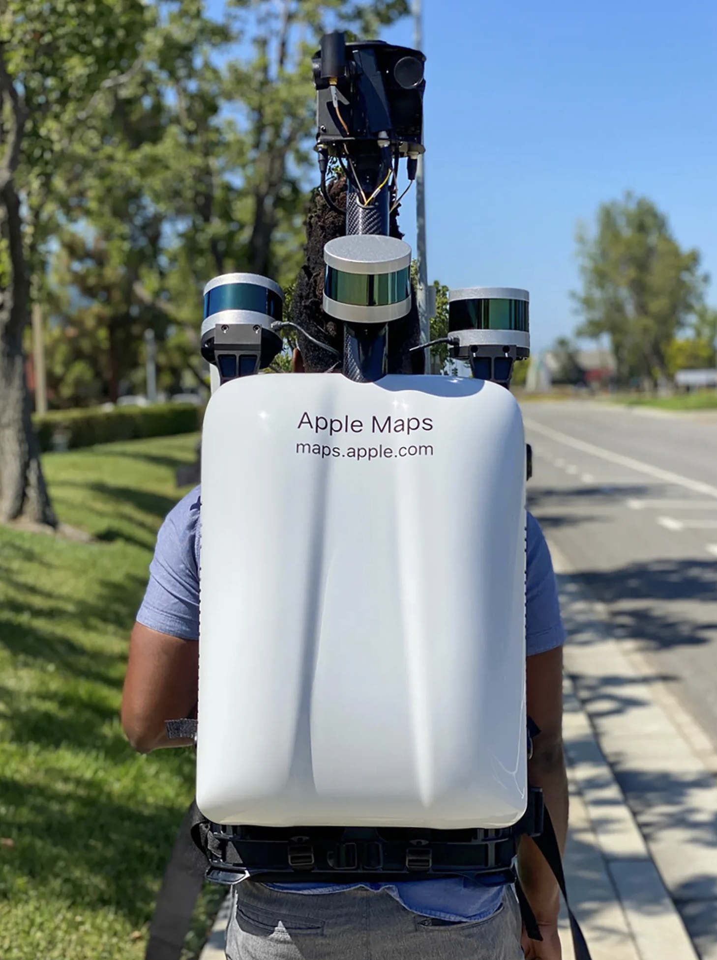 A pedestrian using a backpack system walks around to collect data for the Look Around feature. Photo: The Sun