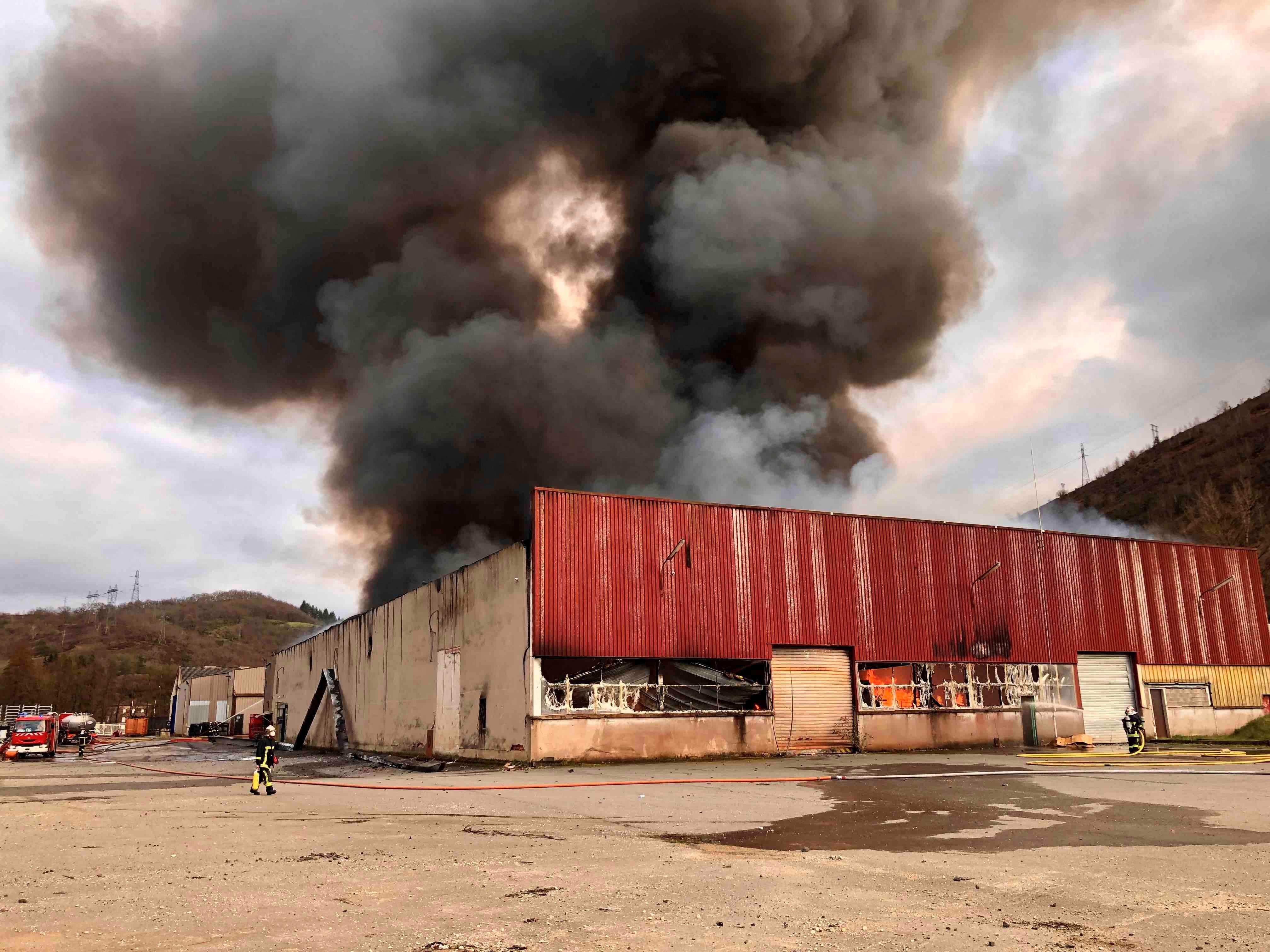 Firefighters respond as a warehouse burns, which houses lithium batteries and is owned by French recycling group SNAM, in Viviez, north of Toulouse, France February 17, 2024 in this image obtained from social media.