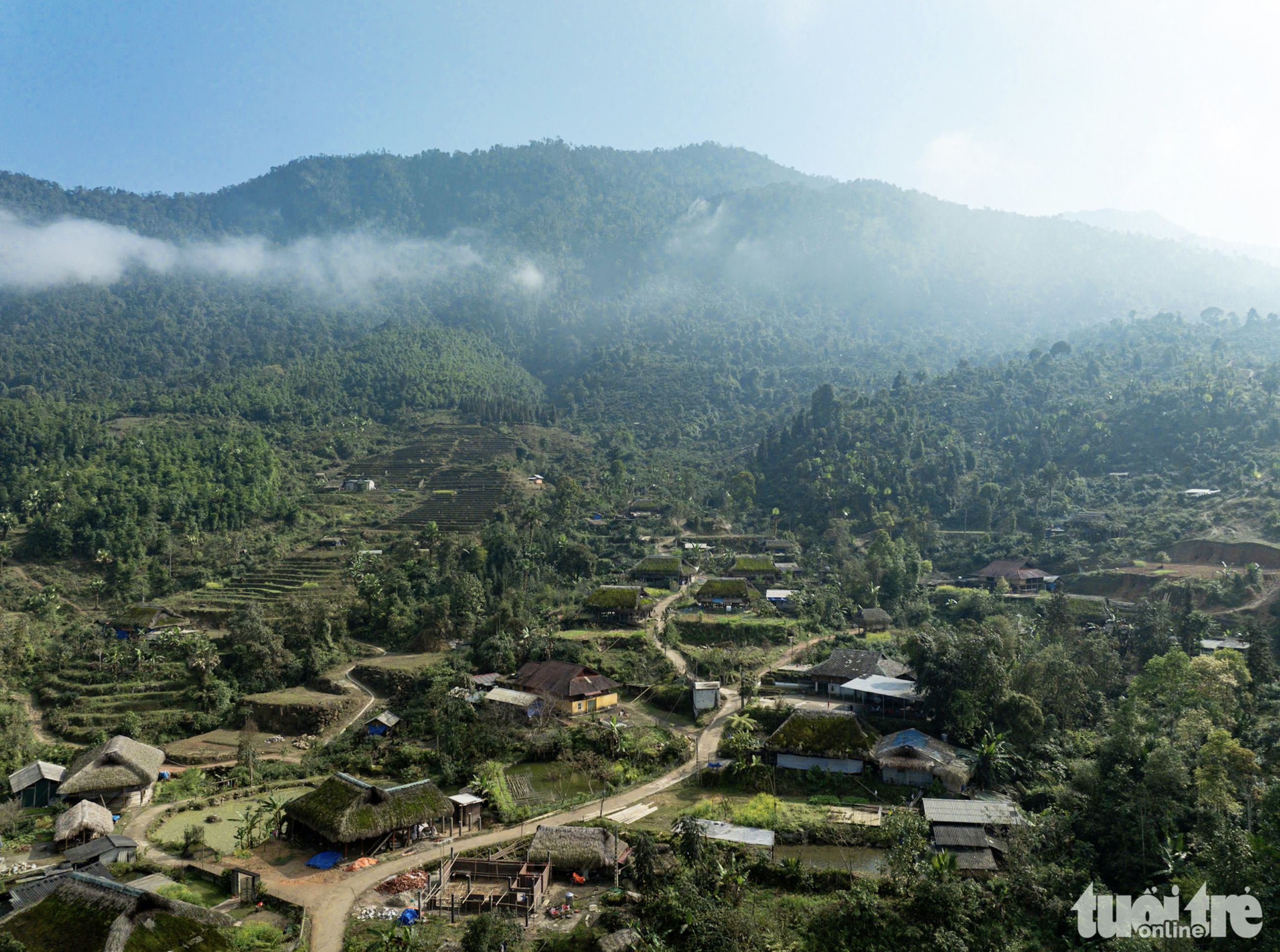 Sunlight shines moss-topped stilt houses in Xa Phin Mountainous Village in Vi Xuyen District under Ha Giang Province, northern Vietnam. Photo: Nam Tran / Tuoi Tre