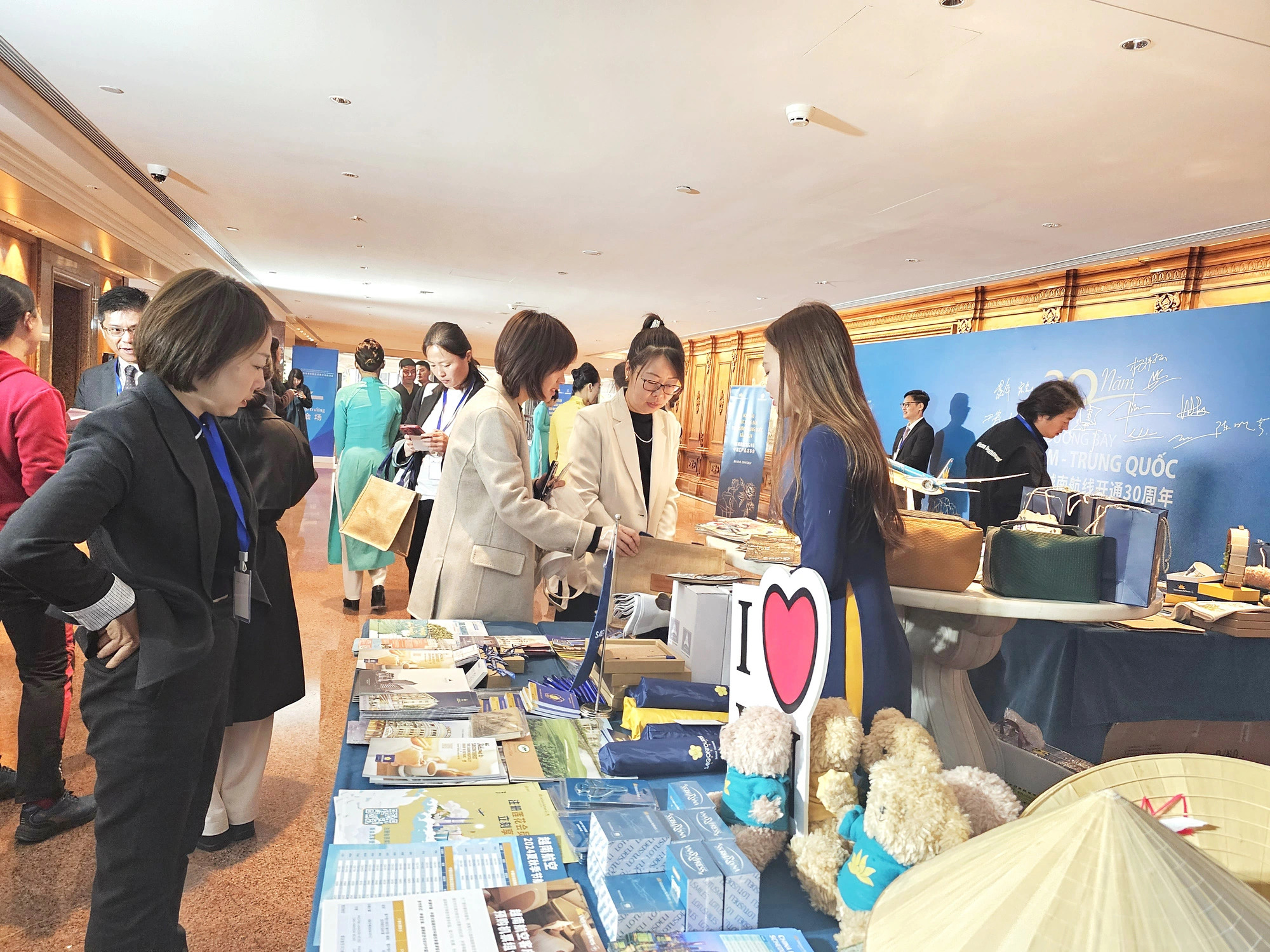 Chinese companies’ representatives visit a Saigontourist Group booth set up in a program promoting Vietnamese destinations in Beijing, China, April 2024. Photo: Supplied