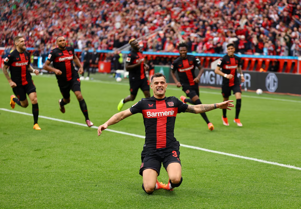 Soccer Football - Bundesliga - Bayer Leverkusen v Werder Bremen - BayArena, Leverkusen, Germany - April 14, 2024 Bayer Leverkusen's Granit Xhaka celebrates scoring their second goal. Photo: Reuters