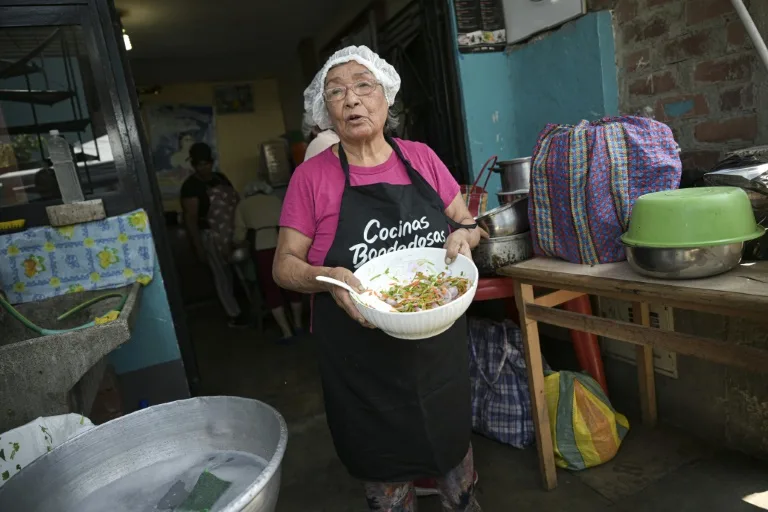 Isabel Santos prepares food using the peels, leaves and stems of vegetables and fruits using culinary techniques to optimize food at the Maria Parado de Bellido soup kitchen in Villa el Salvador, on the southern outskirts of Lima on April 5, 2024. Photo: AFP
