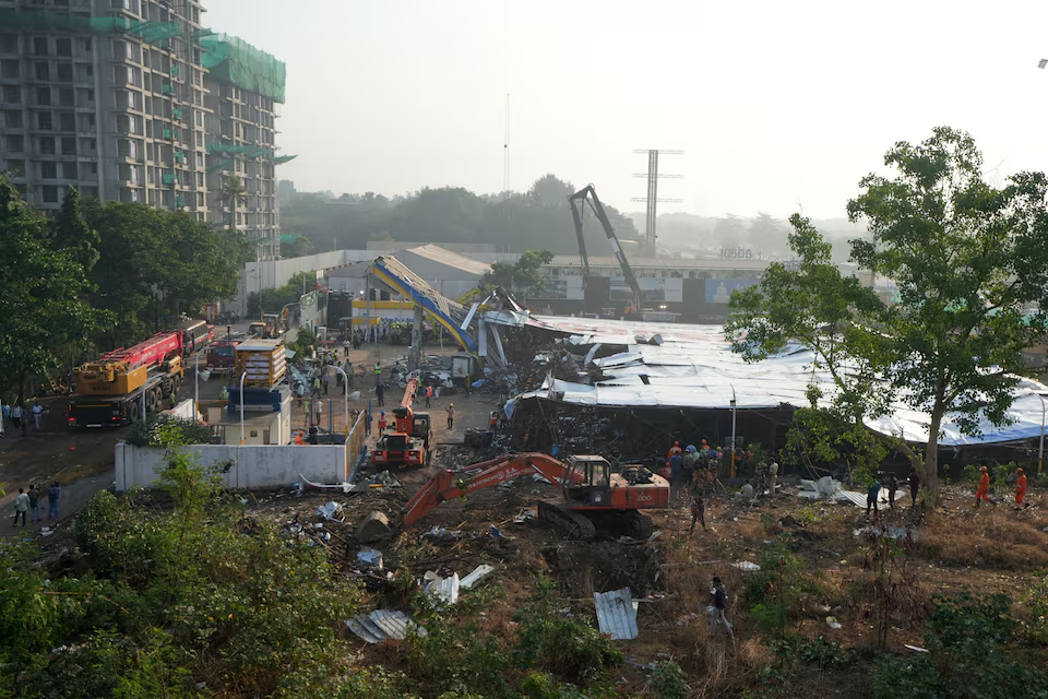 Members of rescue teams search for survivors amidst the debris after a massive billboard fell during a rainstorm in Mumbai, India, May 14, 2024. Photo: Reuters
