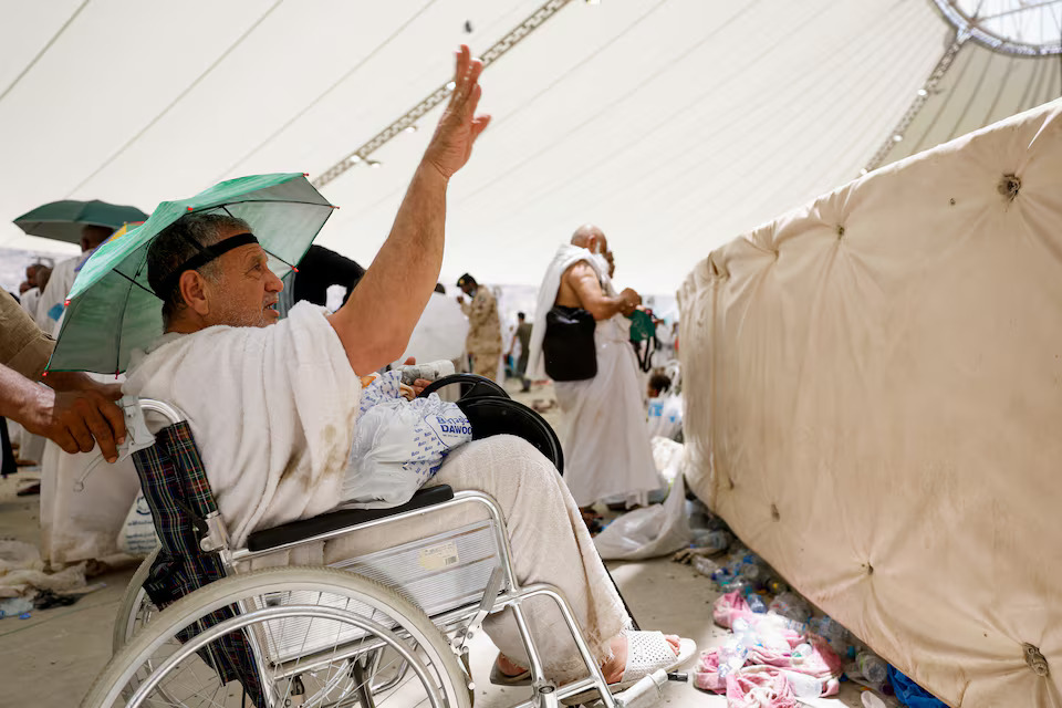 [14/42]A Muslim pilgrim casts a stone at a pillar symbolising Satan, during the annual haj pilgrimage in Mina, Saudi Arabia, June 16. REUTERS/Mohammed Torokman Purchase Licensing Rights