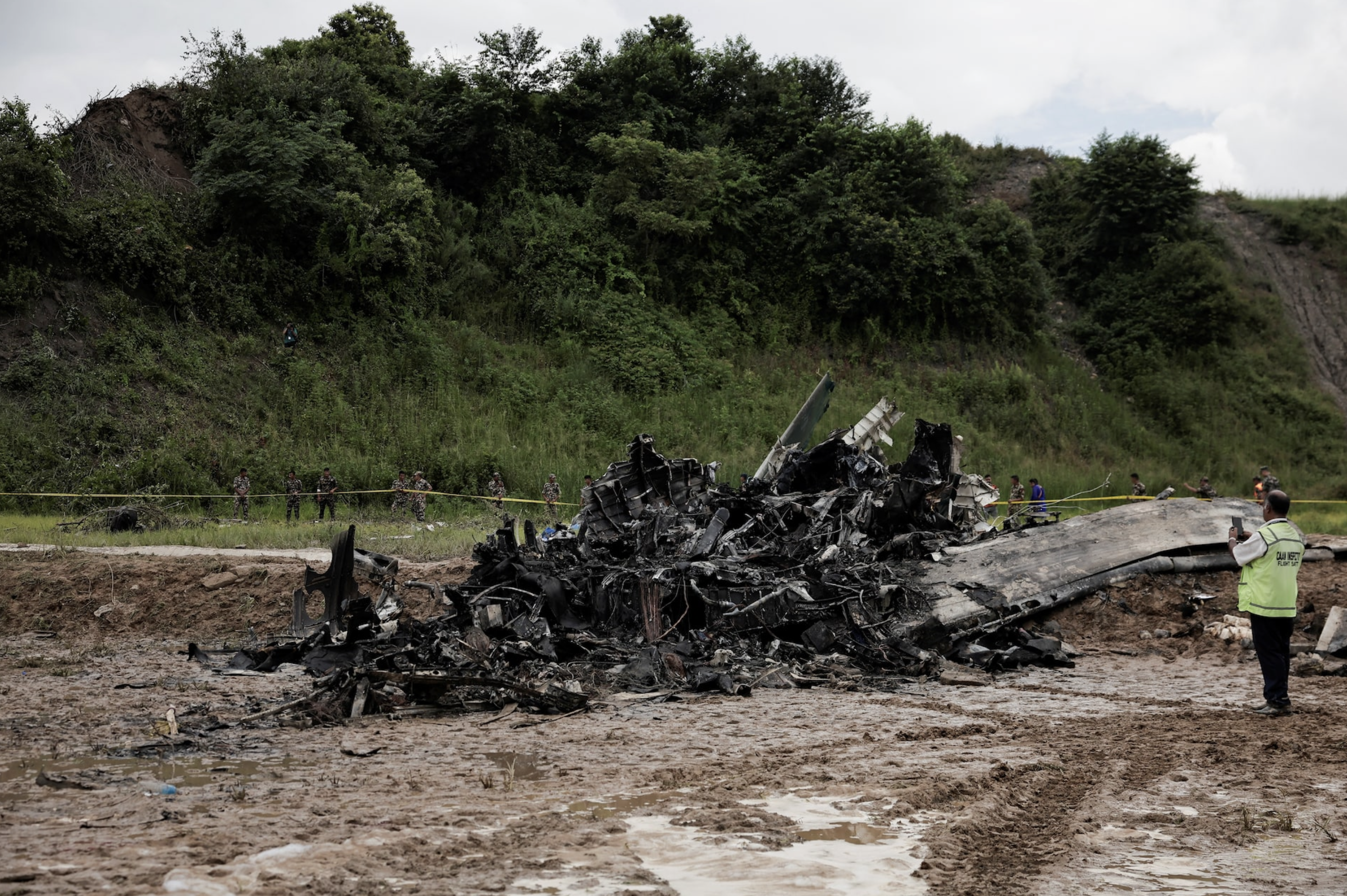 The accident site of a Saurya Airlines plane that caught fire after skidding off the runway while taking off is cordoned at Tribhuvan International Airport, in Kathmandu, Nepal July 24, 2024. Photo: Reuters