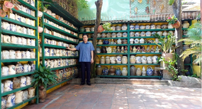 His shelves are full of ancient Vietnamese teapots.