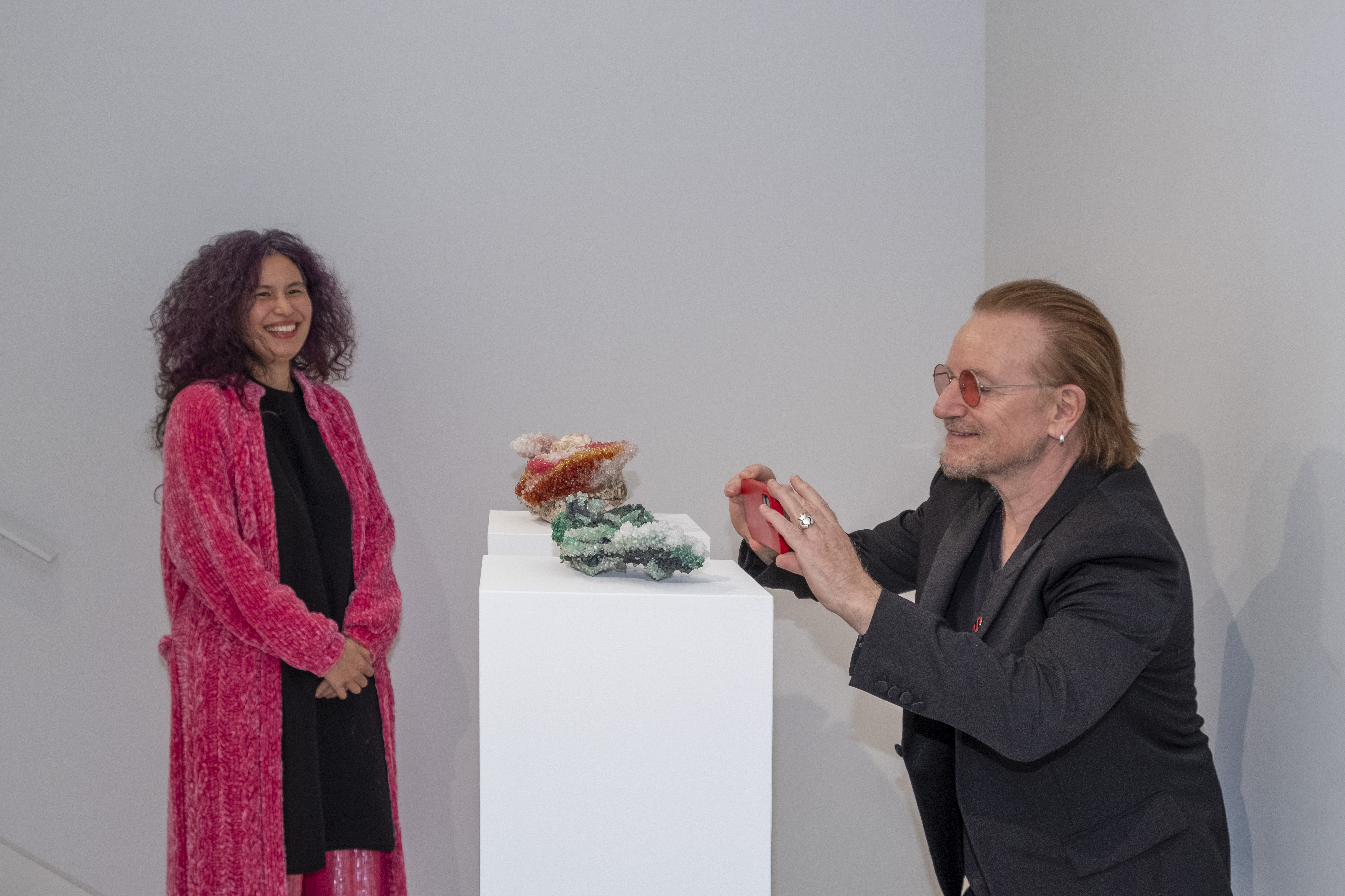 Tia-Thuy Nguyen (L) and singer Bono of U2 band at her 'Burdening Dream' exhibition in Monaco.