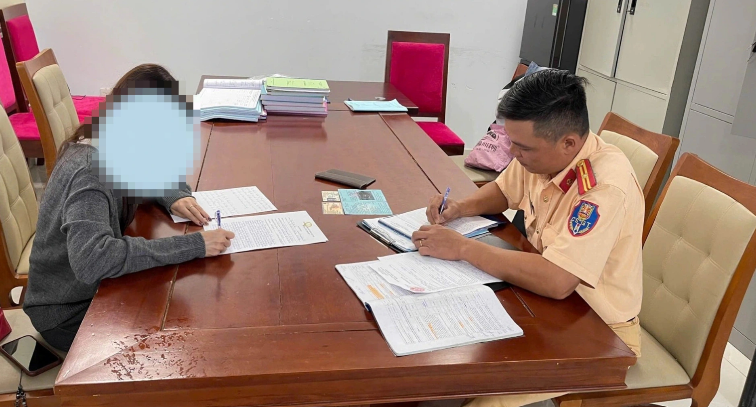 A driver of a car summoned to the police station and booked for installing unauthorized LED lights on her car in Da Nang City. Photo: Supplied