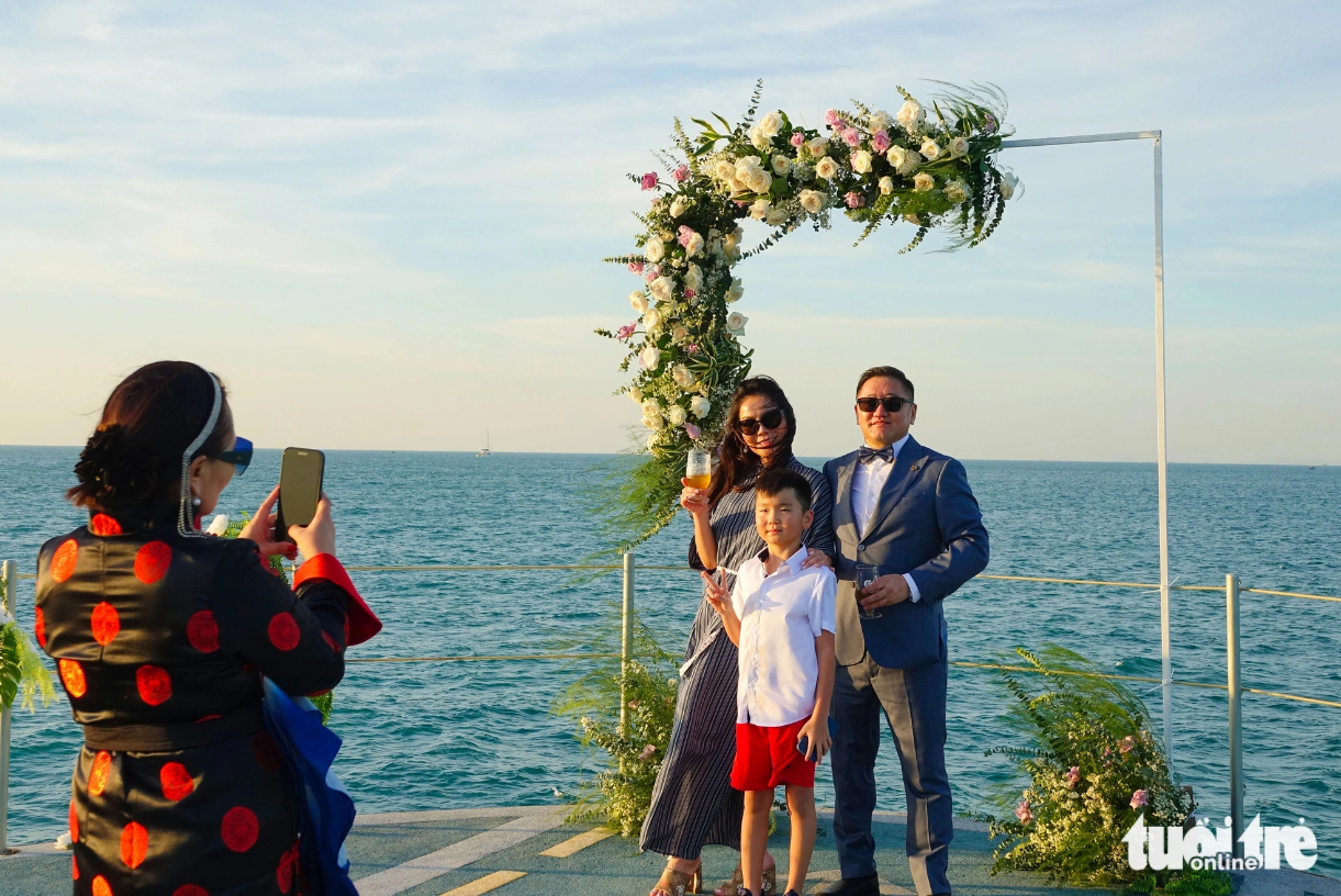 Mongolians pose for a photo at a wedding aboard a cruise ship on Phu Quoc Island off the southern province of Kien Giang. Photo: Chi Cong / Tuoi Tre