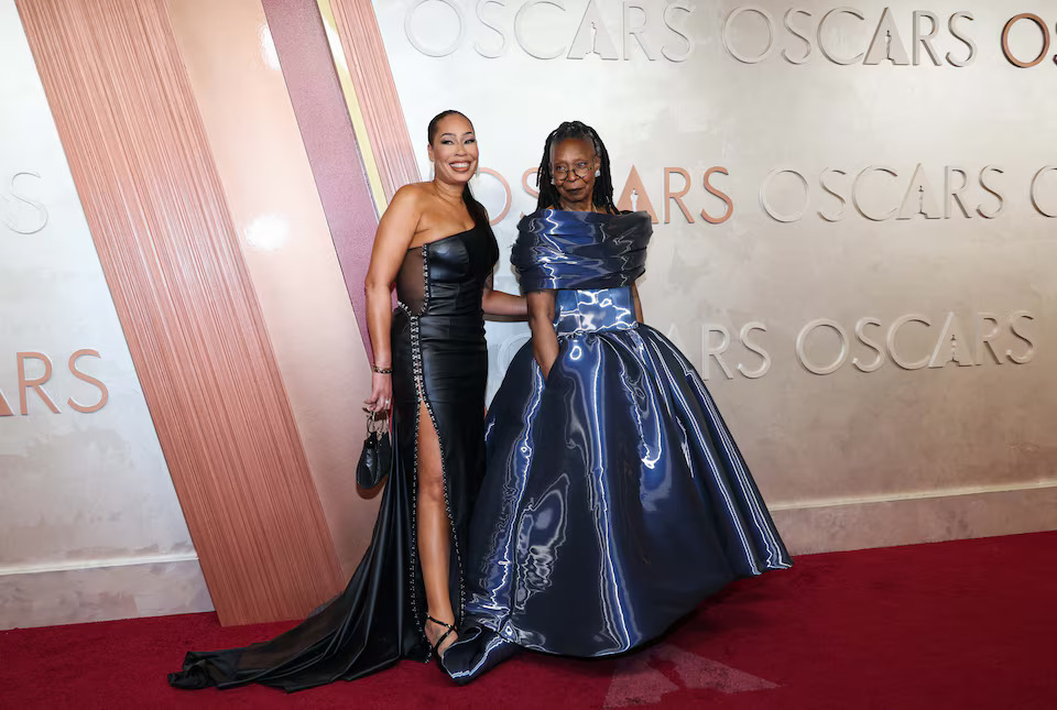 Whoopi Goldberg and Alex Martin Dean pose on the red carpet during the Oscars arrivals at the 97th Academy Awards in Hollywood, Los Angeles, California, U.S., March 2, 2025. Photo: Reuters