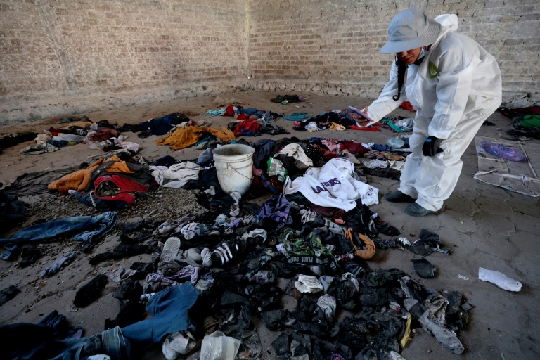 Clothes and shoes are seen abandoned at the site. Photo: AFP