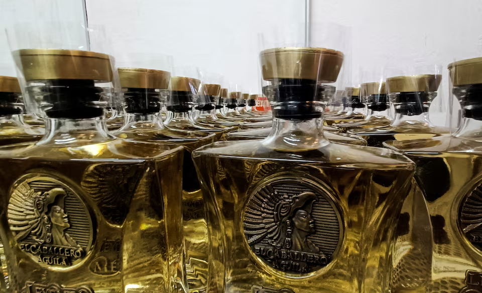Bottles of Tequila El Caballero Aguila, produced by Aguila Azteca Wines and Spirits, a 100% woman-staffed distillery, are displayed as U.S. President Donald Trump plans to impose a 25% import tax, in Valle de Guadalupe, Jalisco, Mexico, February 10, 2025. Photo: Reuters