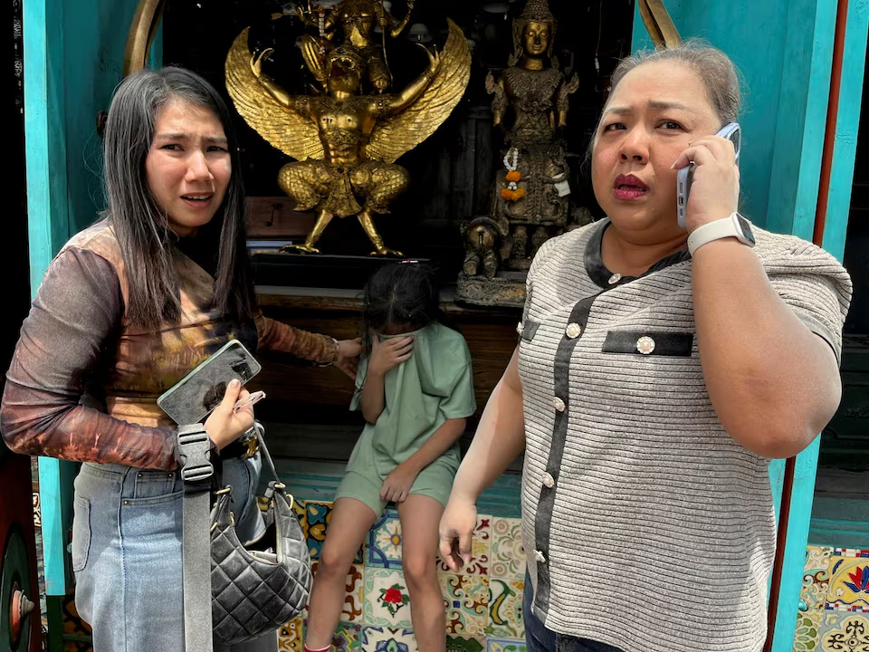 Women and a child react after a strong earthquake struck central Myanmar on Friday, earthquake monitoring services said, which affected Bangkok as well with people pouring out of buildings following the tremors in the Thai capital, in Bangkok, Thailand, March 28, 2025. Photo: Reuters
