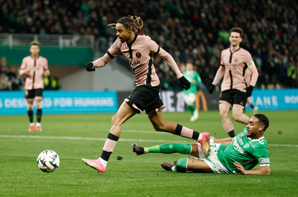 [2/5]Soccer Football - Ligue 1 - AS Saint-Etienne v Paris St Germain - Stade Geoffroy-Guichard, Saint-Etienne, France - March 29, 2025 Paris St Germain's Bradley Barcola in action with AS Saint-Etienne's Yvann Macon. Photo: Reuters
