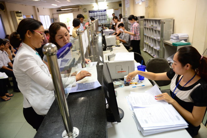 Người dân đến làm thủ tục tại phòng đăng ký kinh doanh, Sở Kế hoạch - đầu tư TP.HCM - Ảnh: Quang Định