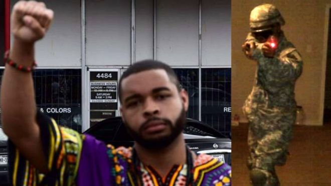 Ảnh từ Facebook cho thấy Micah Johnson giơ cao nắm đấm và mặc quân phục - Ảnh: Facebook