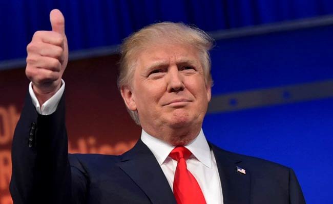 Ông Trump hoãn công bố cách thức rút lui khỏi công việc kinh doanh để làm tổng thống Mỹ - Ảnh: AFP