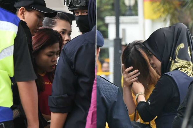 Nghi can Siti Aisyah (trái) và Đoàn Thị Hương (che mặt) khi được dẫn tới tòa - Ảnh: AFP