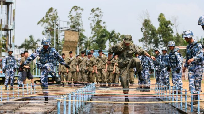 Chinese and Russian soldiers take part in a joint military drill in Zhanjiang, Guangdong province, China, Sept. 13, 2016.