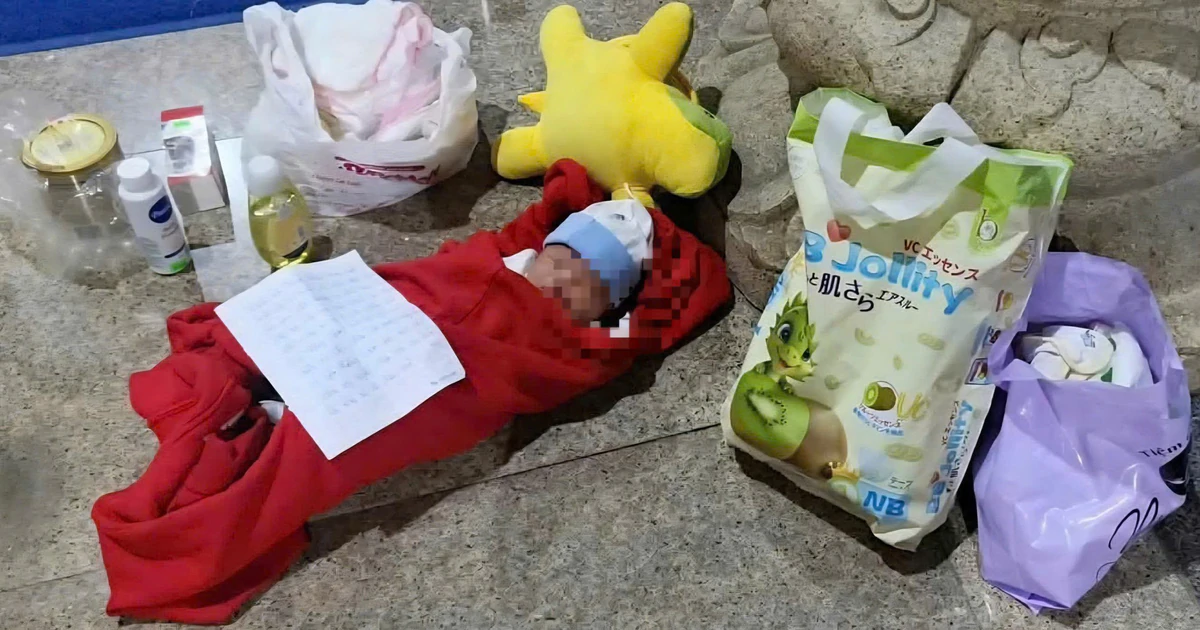 Abandoned newborn boy is being cared for by a nun at a temple