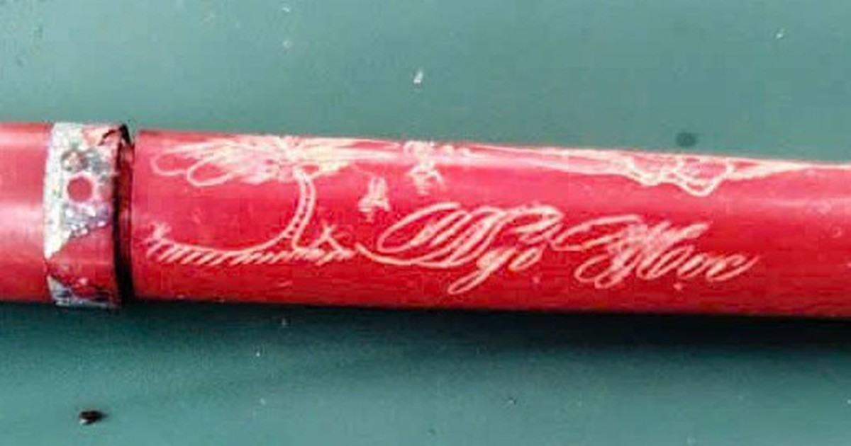 Inscribed pen found in a Vietnamese war hero’s grave could help identify him