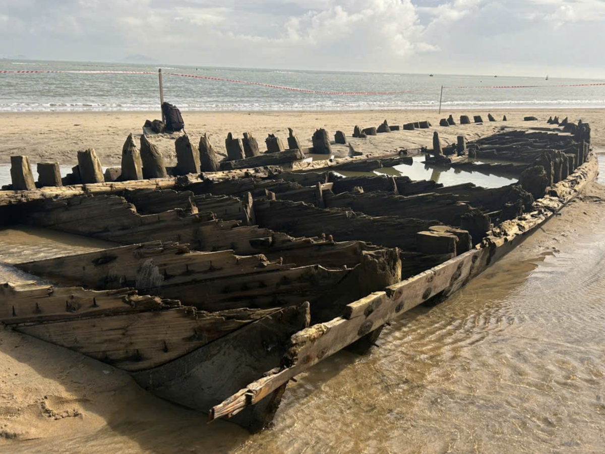 Centuries-old shipwreck exposed on Vietnam beach after storm Kalmaegi