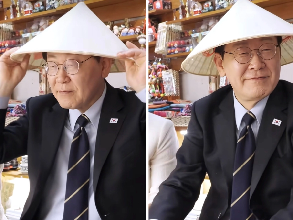 South Korea’s president dons conical hat, samples durian on Hanoi streets