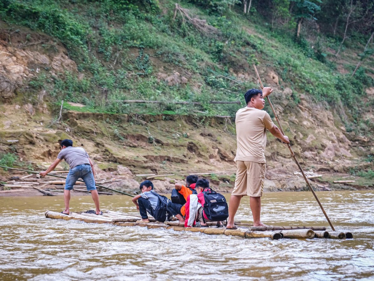 Students brave dangerous bamboo raft rides to school in Vietnam as authorities seek funds for safer crossing