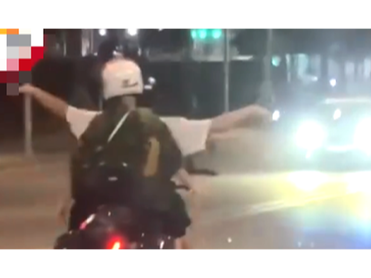 Foreigner has motorcycle confiscated for riding hands-free i