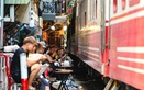 Hanoi’s Train Street stays packed despite foreign tourist’s phone being struck by train