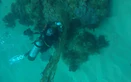 Divers clean up abandoned fishing nets to save marine life off central Vietnam island