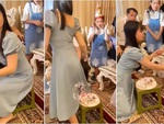 Cô gái ngượng đỏ mặt vì lỡ ngồi bẹp bánh gato bị cháu bắt đền