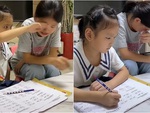 Chị gái mếu máo khi dạy em học bài