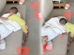 Bé trai đắp chăn cho mẹ ngủ