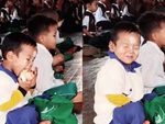 Biểu cảm đáng yêu của bé trai khi ăn vụng