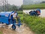 Pha lái máy tuốt lúa đi vào lòng ruộng