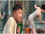 Chàng trai bị bạn gái đánh vì mải nhìn người đẹp lau kính
