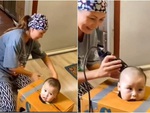 Mẹ dùng tuyệt chiêu để con nhỏ chịu ngồi yên khi cắt tóc