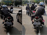 Chàng trai giữ thăng bằng xe máy 30 giây khi chờ đèn đỏ