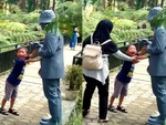 Bé trai nghịch ngợm bị 'người tượng' hù phen hú hồn
