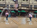 Cô gái quê một cục khi tạo dáng chụp hình dưới cầu vồng nước