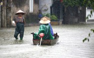 Floods force evacuation of thousands in northern Vietnam, while landslide kills 3 family members 