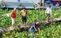 Người dân đi tập thể dục phát hiện thi thể trôi trên sông Tiền