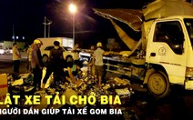 Lật xe tải chở bia, người dân giúp tài xế gom bia