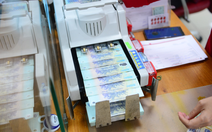 Tin tức sáng 3-12: Lãi suất liên ngân hàng qua đêm lên 7%