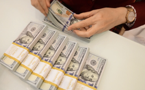 Tin tức sáng 25-11: Doanh nghiệp vay USD chịu áp lực lớn khi tỉ giá tăng