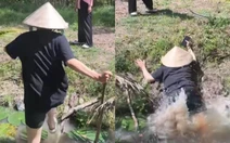 Cô gái vồ ếch khi nhảy qua mương nước