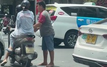 Đưa tài xế xe công nghệ rút chìa khóa xe máy của cô gái ở hồ Con Rùa về trụ sở làm việc