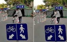Người đàn ông hiểu nhầm bảng chỉ dẫn xe đạp và người đi bộ